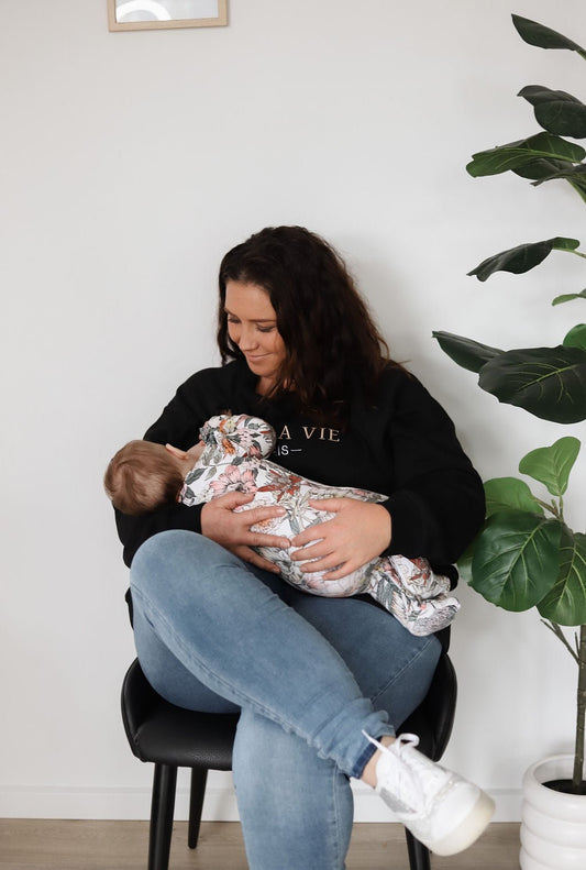 Black breastfeeding jumper with hidden zippers for discreet nursing